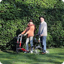 People standing outdoors with walkers
